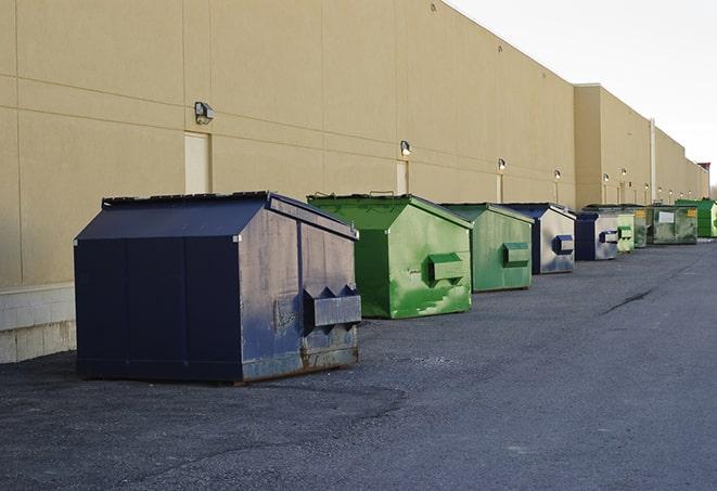 big yellow dumpsters on a construction lot in Brea CA