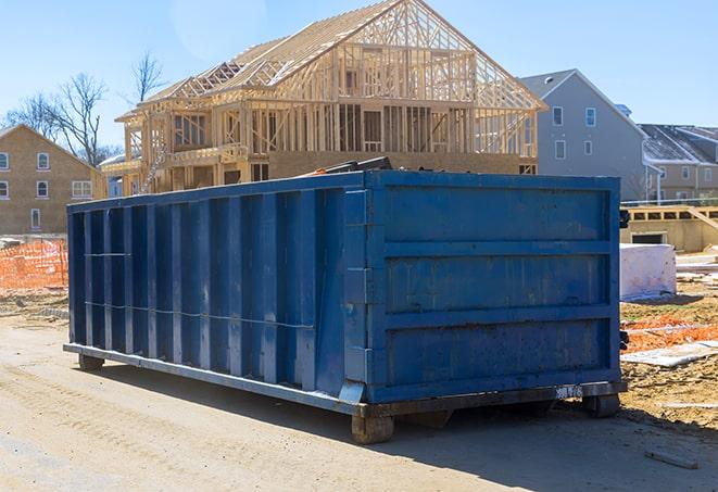 dumpsters in a residential area ready for neighborhood cleanup